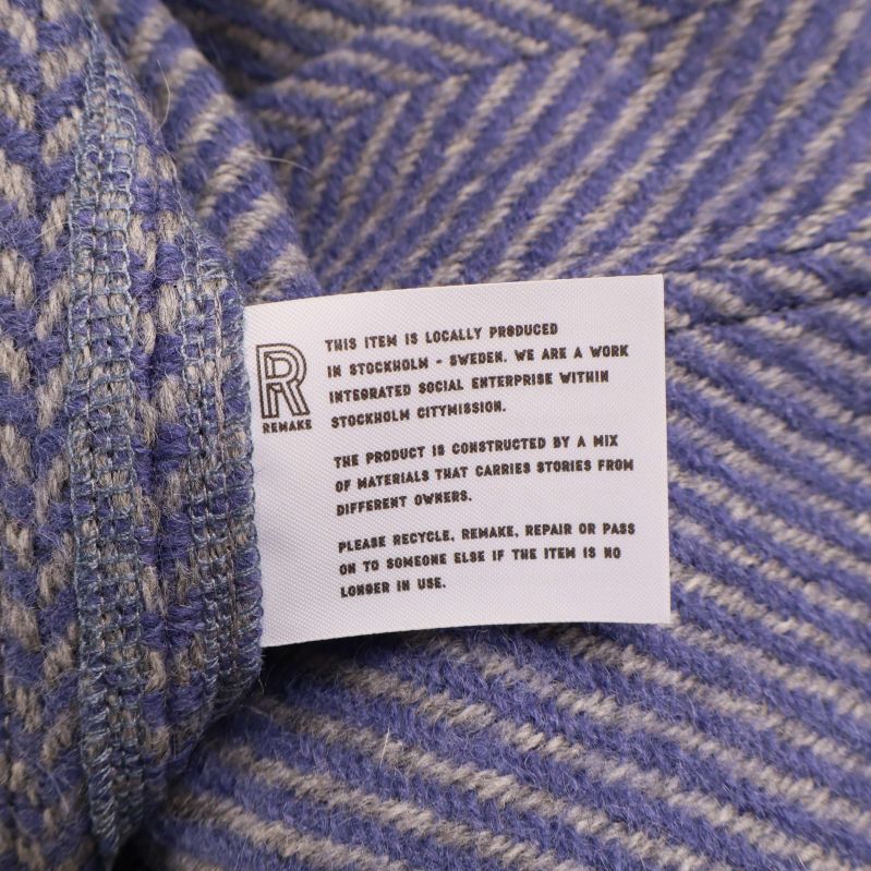 Textil etikett om lokal produktion och materialblandning