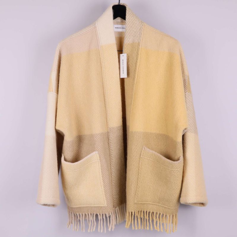 Oversize kofta i beige toner med fransar och fickor framtill
