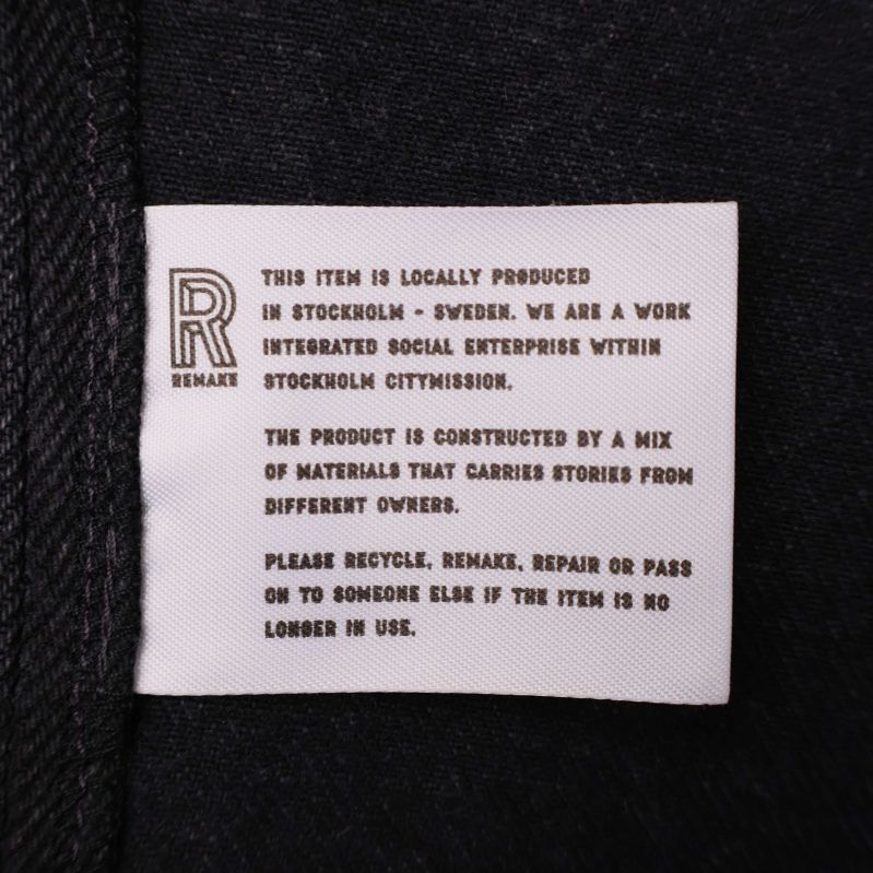 Etikett med Remake-logotyp och information om produkten