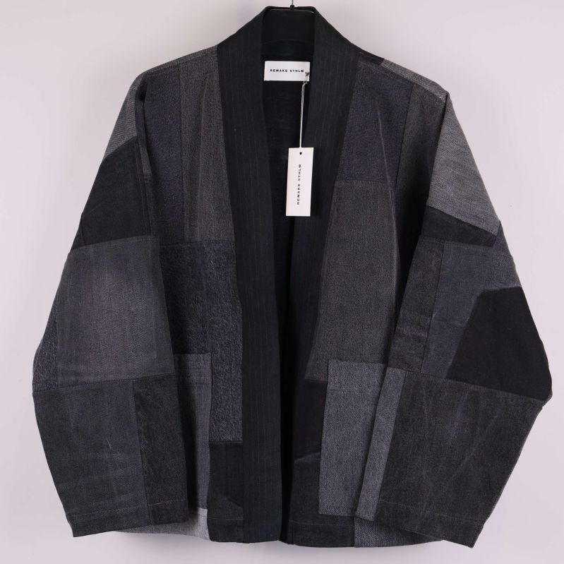 Patchwork jacka i denim med öppen front och breda ärmar