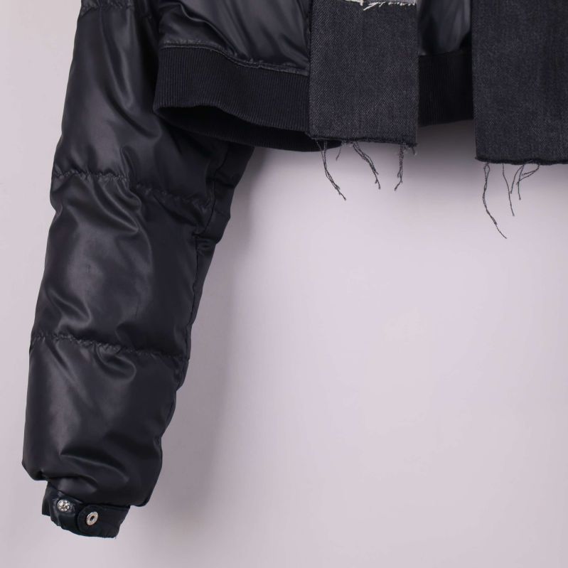 Närbild på vadderad ärm och nederkant av jacka