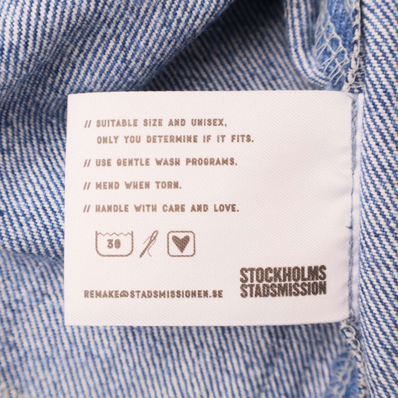 Inneretikett med tvättråd och storleksmarkering 58