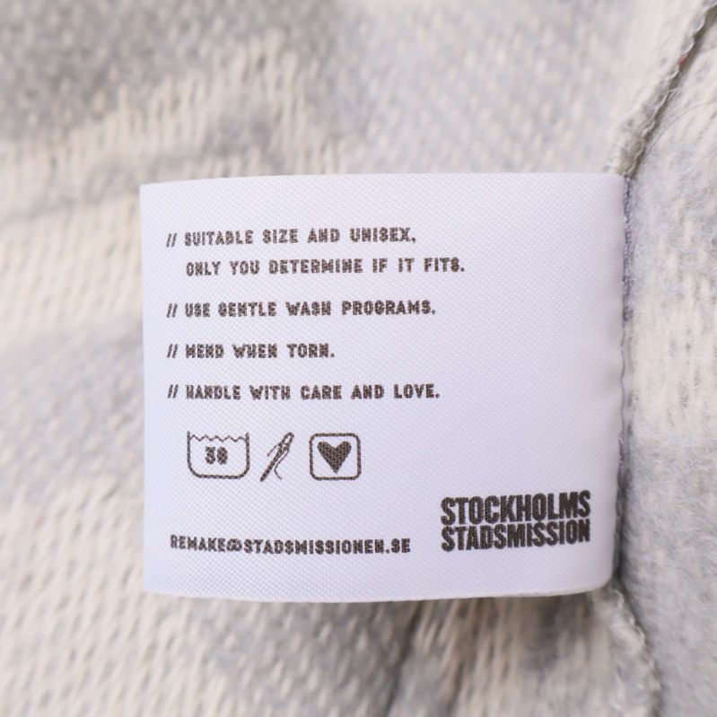 Tvätt- och skötselrådsetikett för cardigan