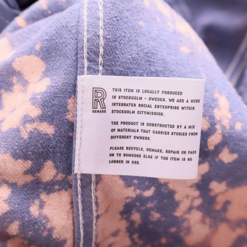 Invändig etikett med information om material och produktion