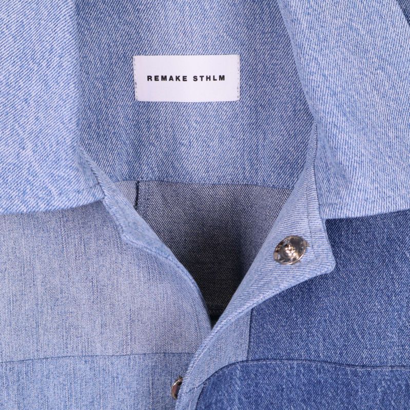 Närbild på krage och etikett med Remake Sthlm