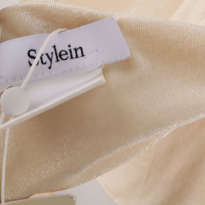 Närbild på etikett med märket: Stylein
