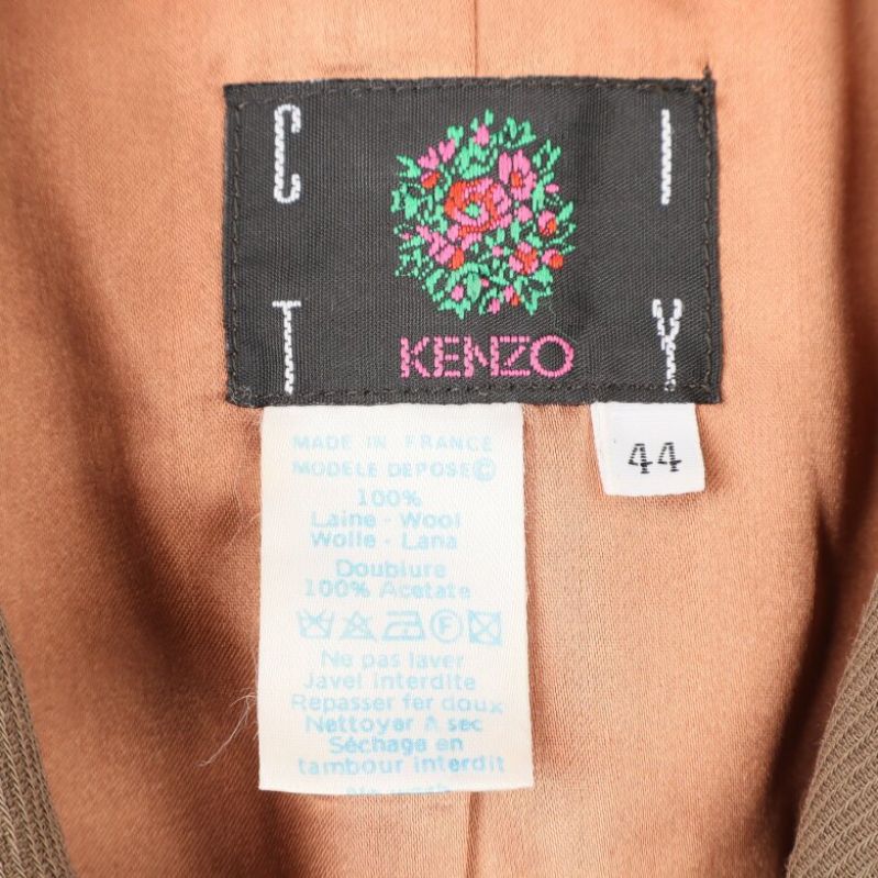 Kenzo etikettsmärke på insidan av brun kavaj