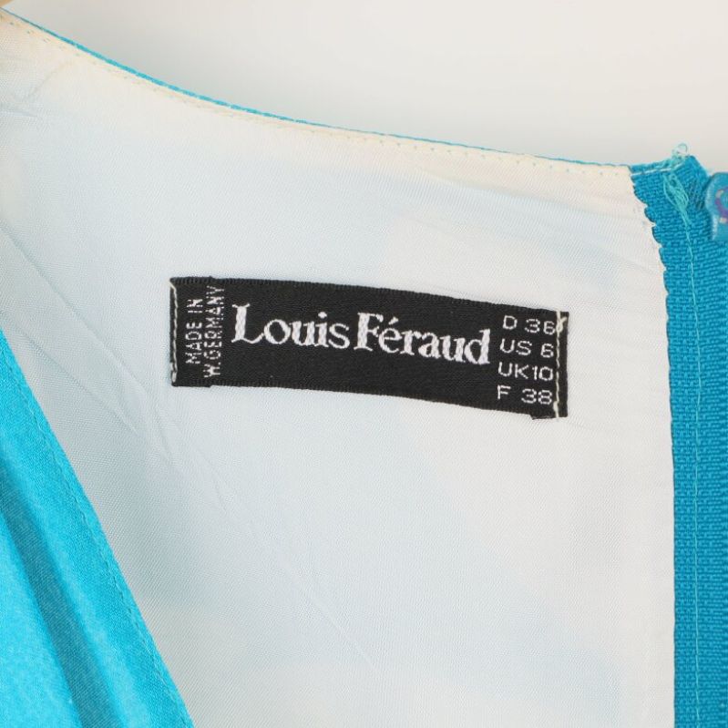 Märkesetikett 'Louis Féraud' inuti klänningen