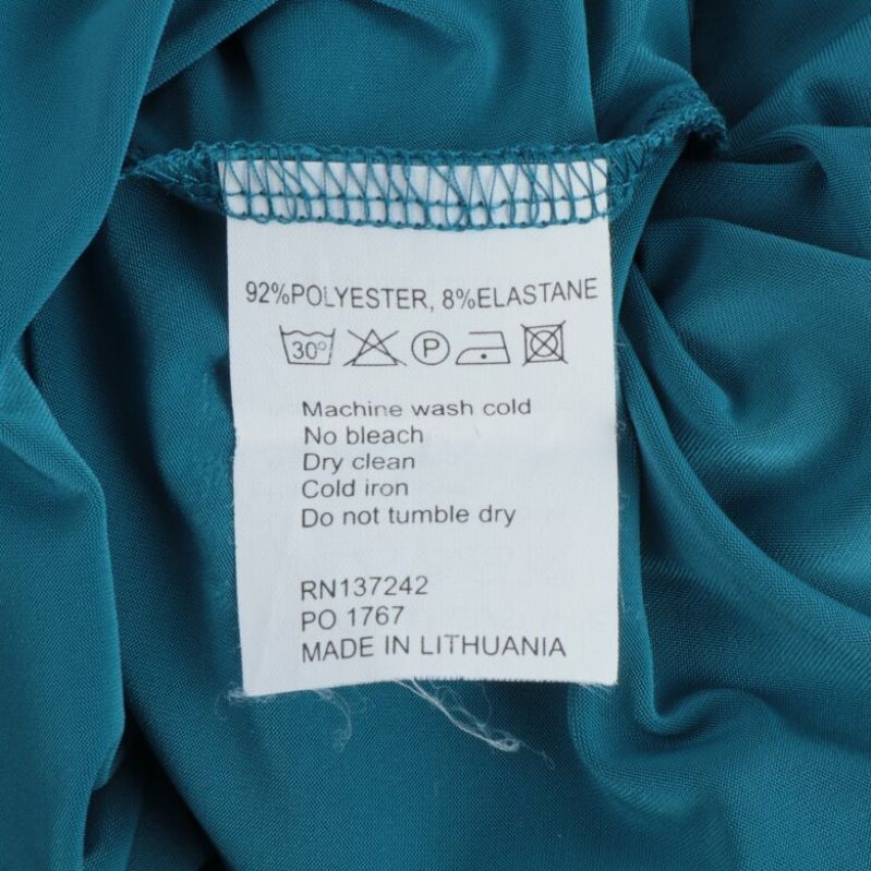 Materialetikett visar polyester och elastan