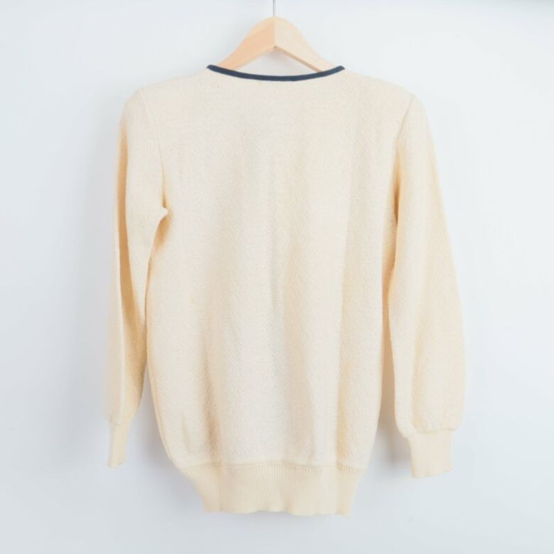Baksidan av ljus stickad cardigan