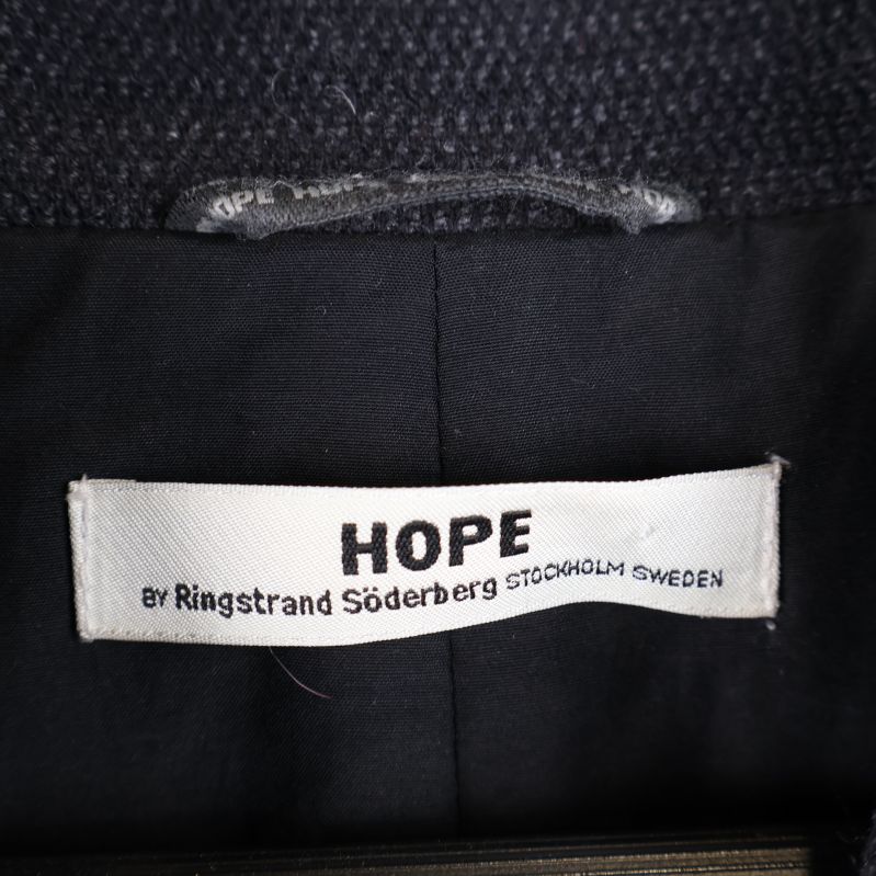 Hope etikett inuti kappan