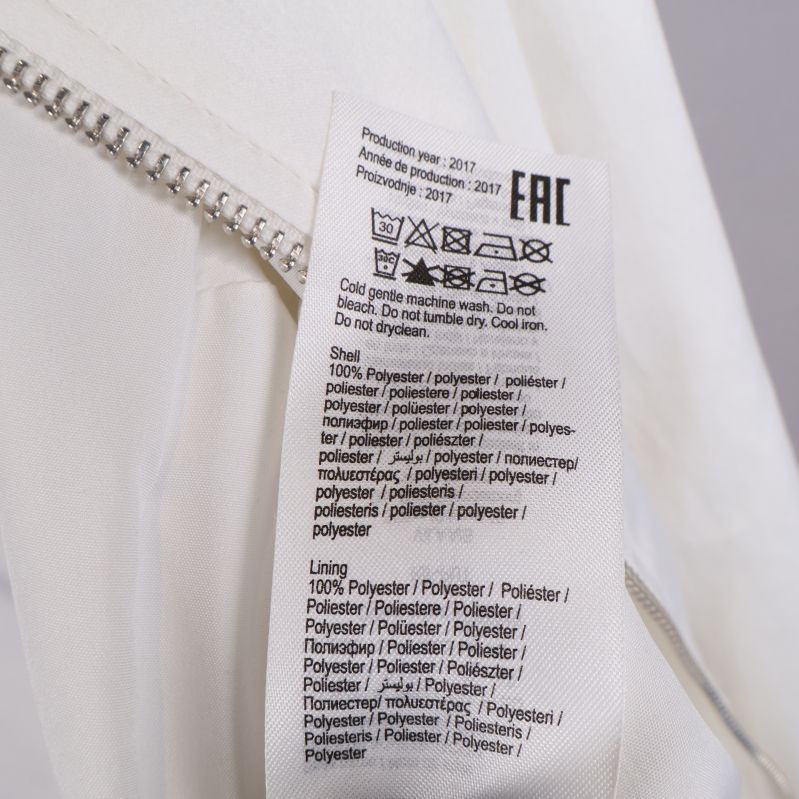Materialinformation på tvättrådsetikett