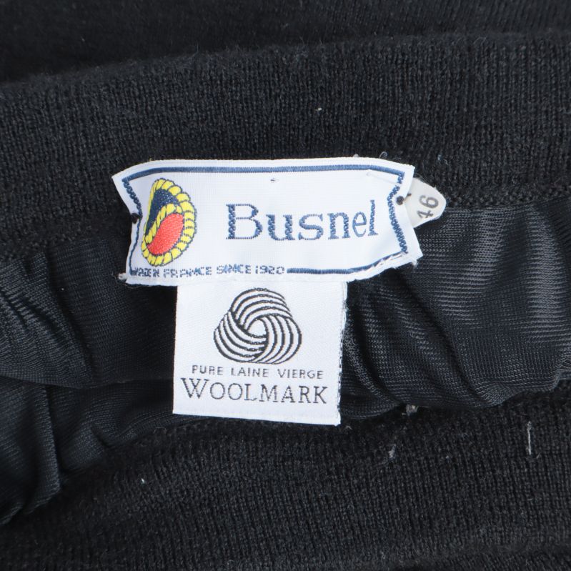 Busnel logotyp och Woolmark etikett