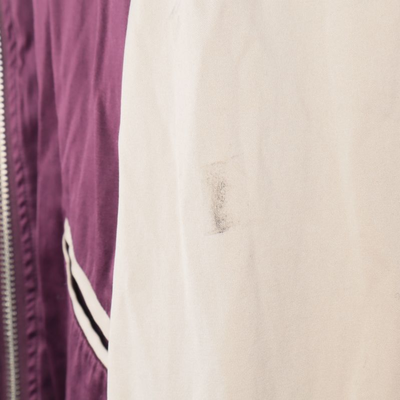 Detalj av fläck på jackan