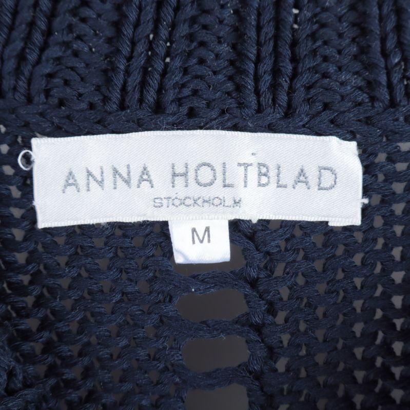 Etikett med Anna Holtblad och storlek M