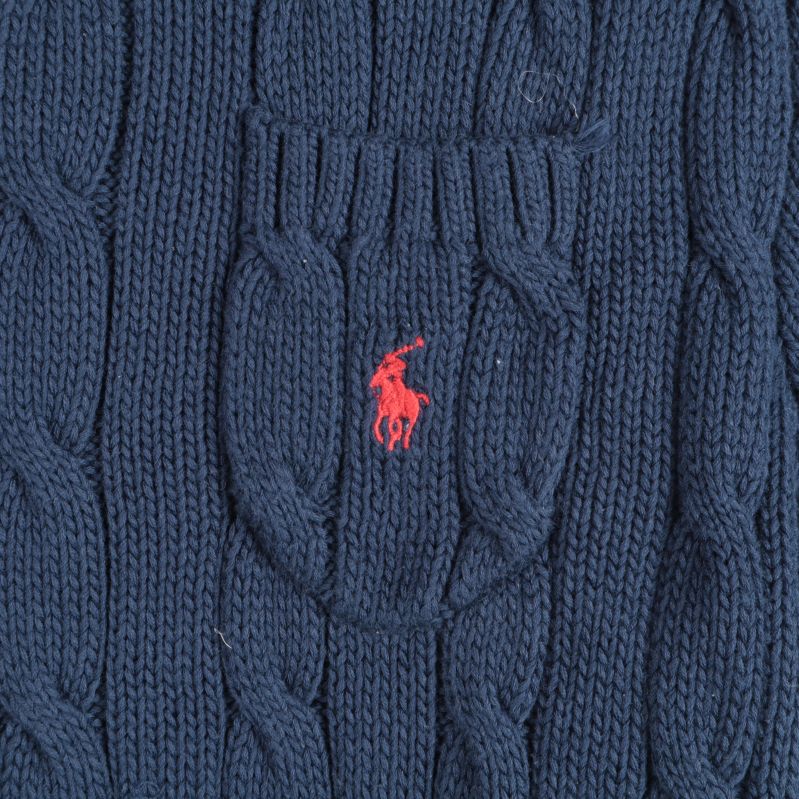 Broderat emblem på bröstficka