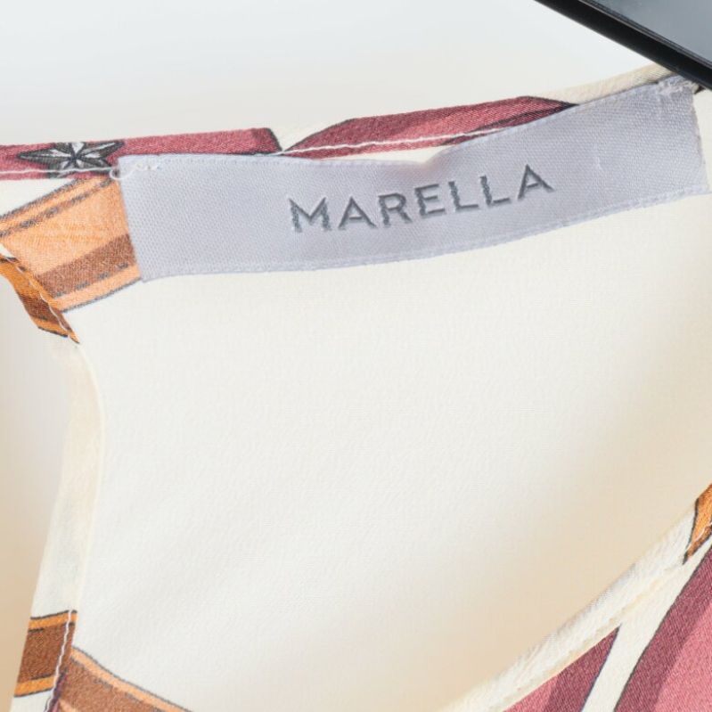 Märke:  Marella, på blusens inre
