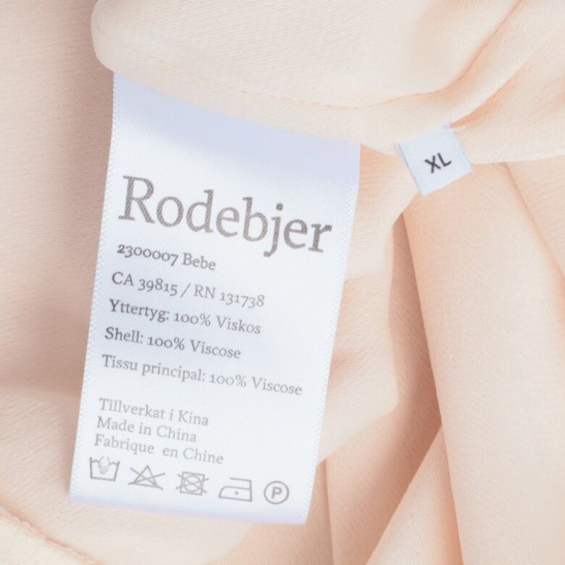 Materialetikett visar : 100% viskos