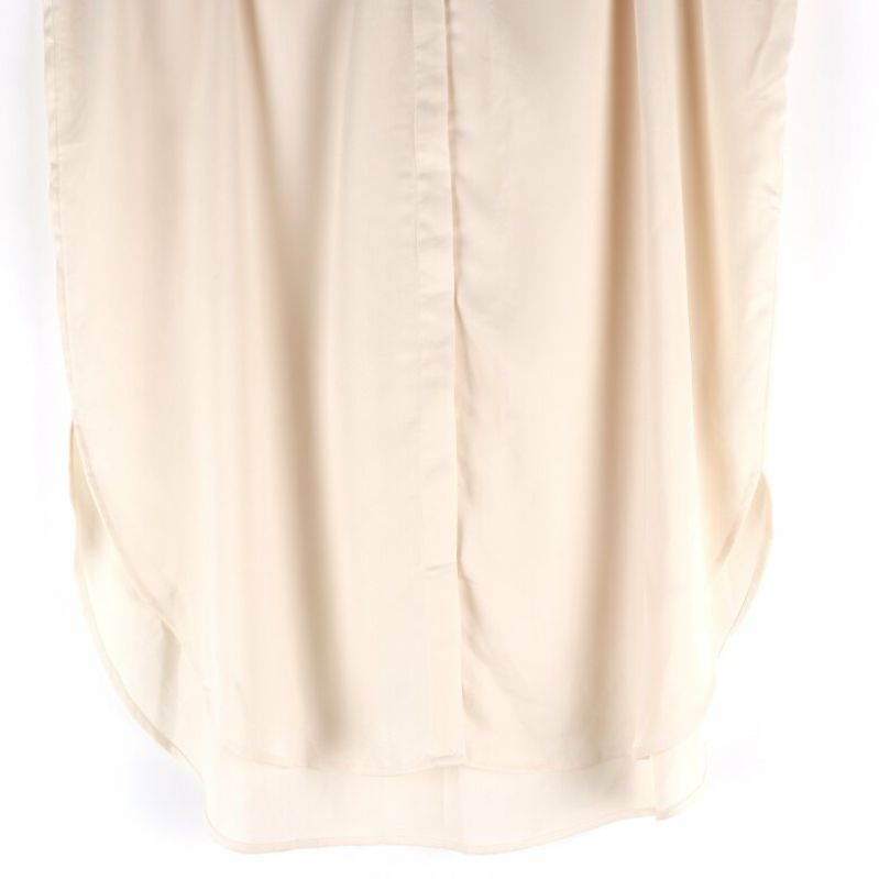 Nederdelen av beige kaftan klänning