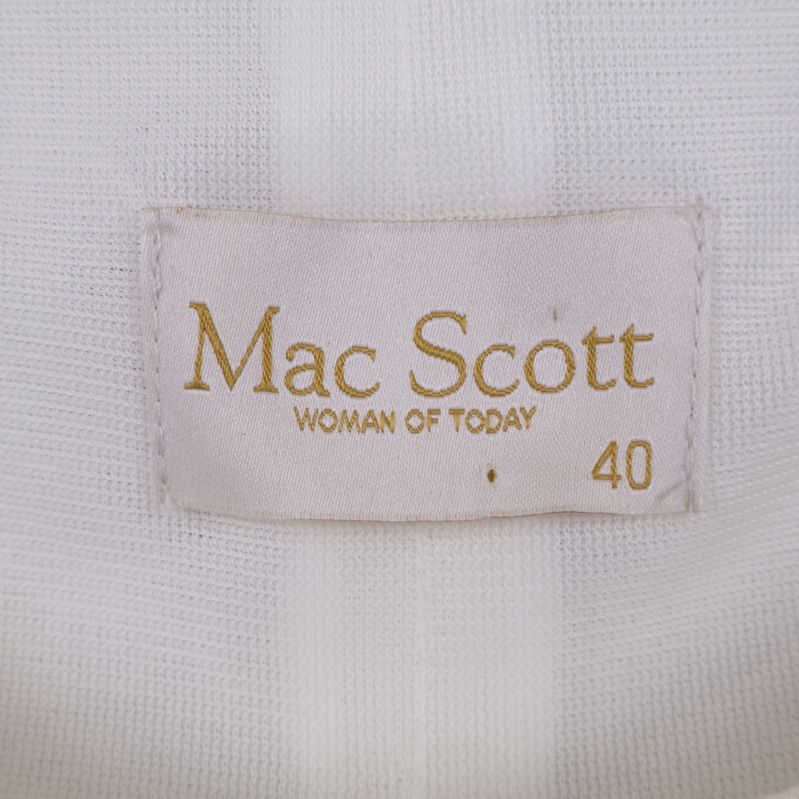 Närbild av etikett med Mac Scott