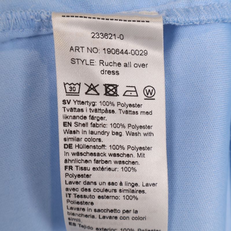 Materialetikett visar 100% polyester