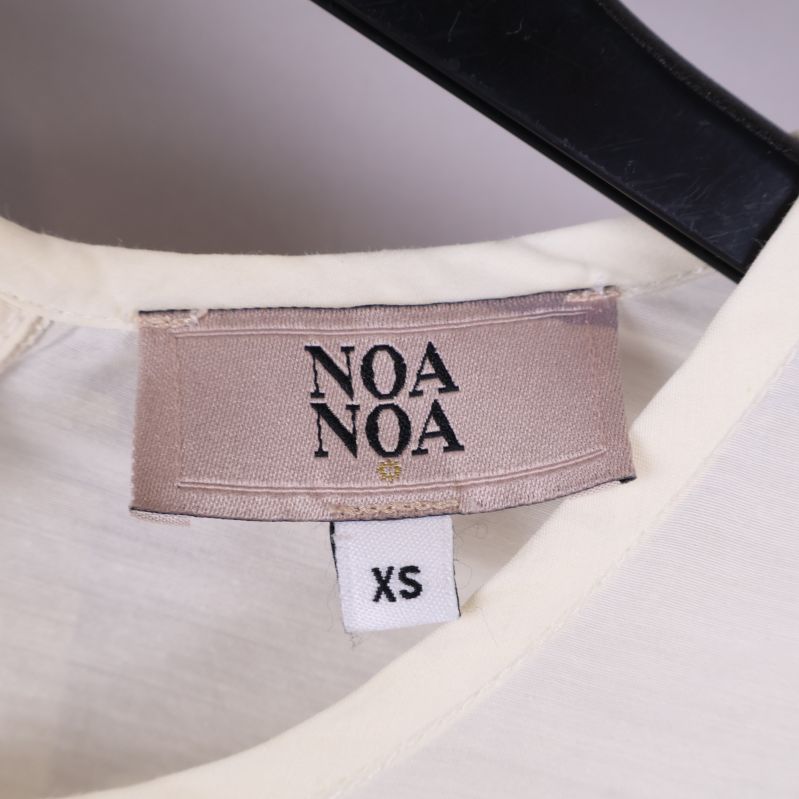 Närbild på Noa Noa etiketten