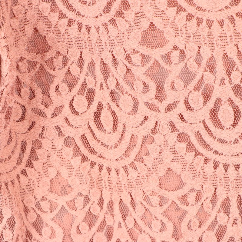 Närbild av mönstrad rosa spets