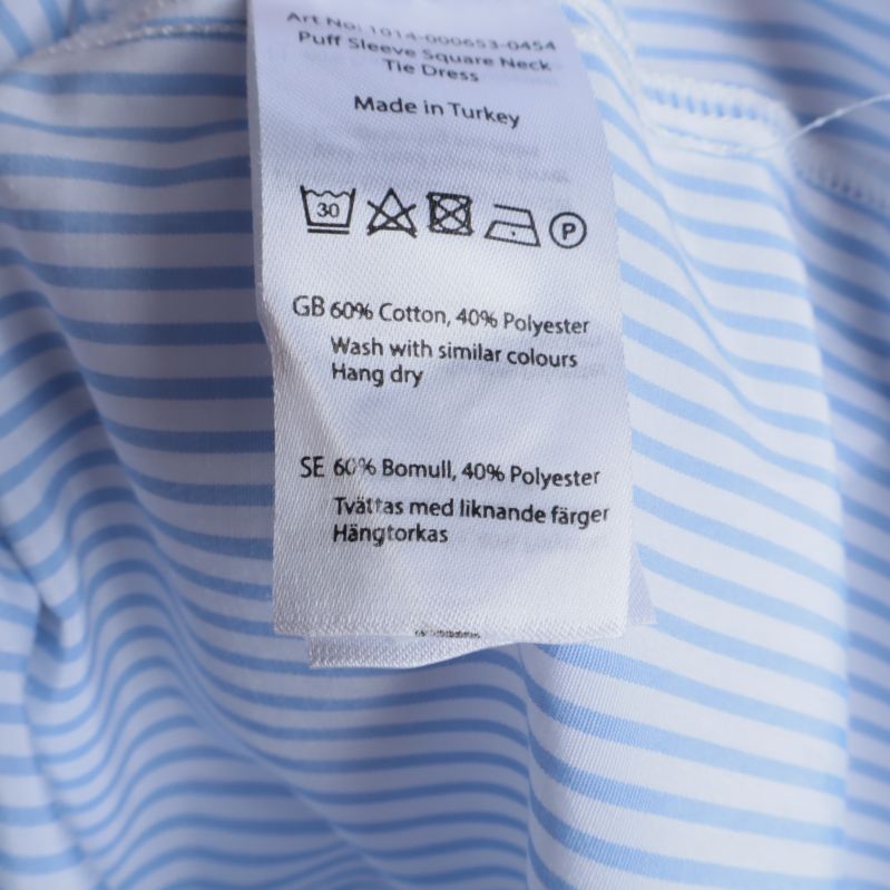 Materialetikett visar bomull och polyester