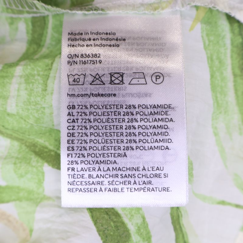 Materialtagg med tvättinstruktioner och sammansättning