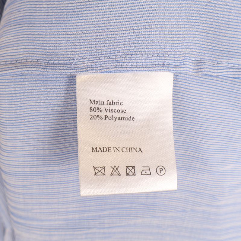 Materialetikett visar 80% viskos och 20% polyamid