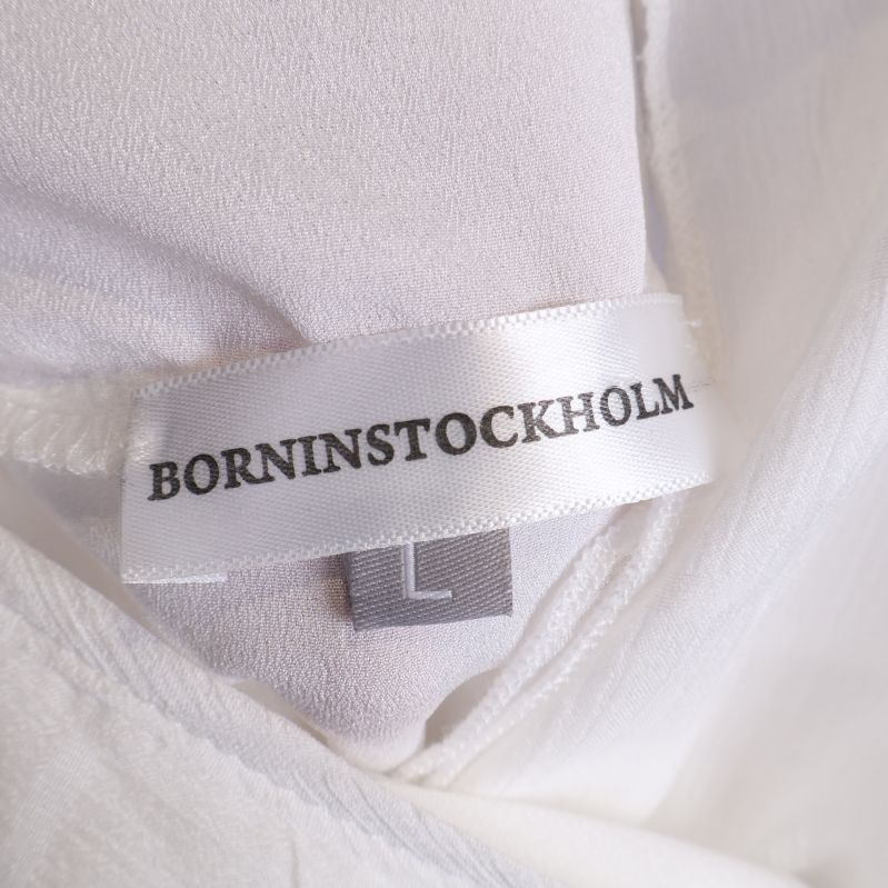 Borninstockholm märkesetikett inuti klänningen