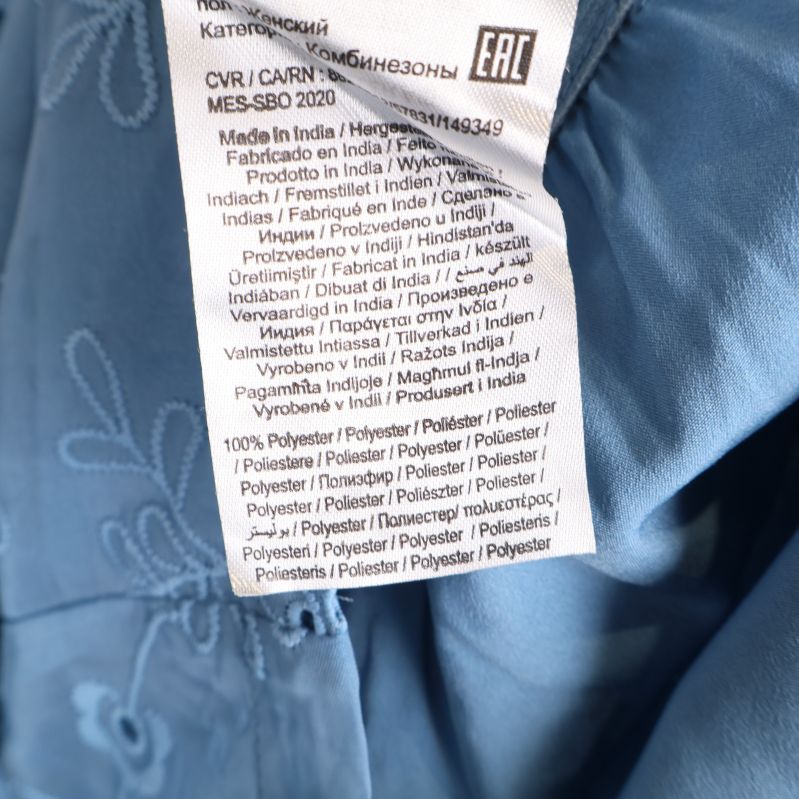 Materialetikett med information om polyester