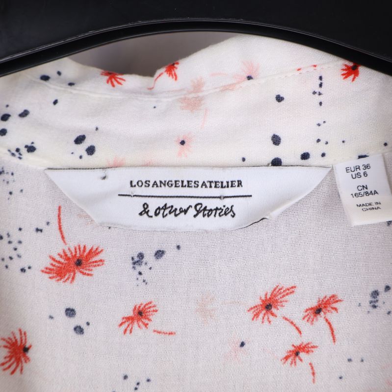Blustagg med & Other Stories logotyp