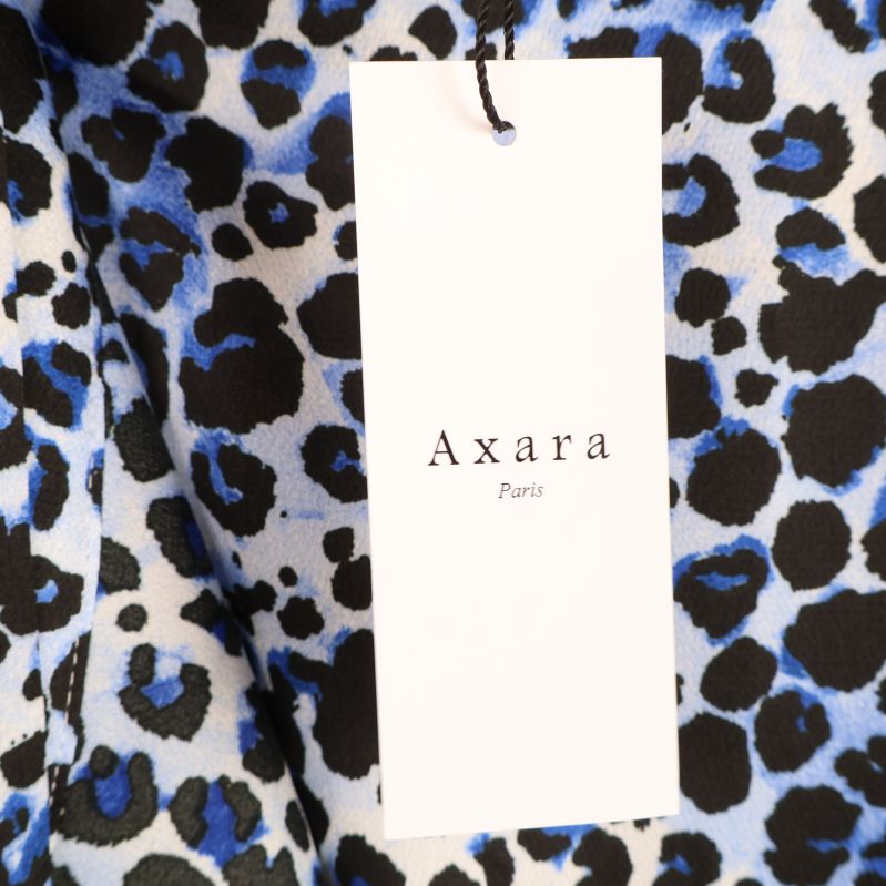 Axara Paris produktetikett på blå och svart kjol