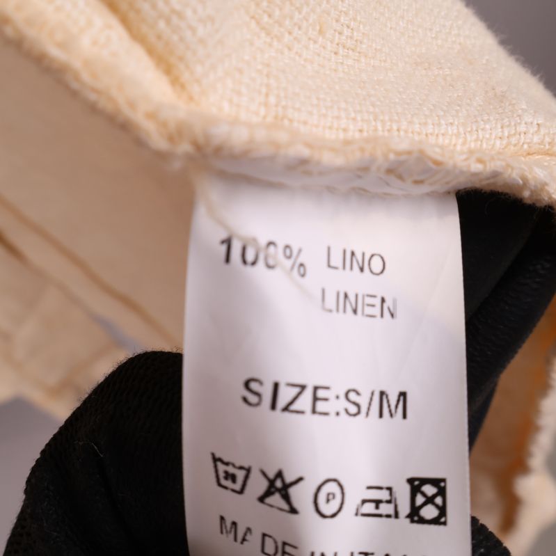 Materialetikett visar 100% linne