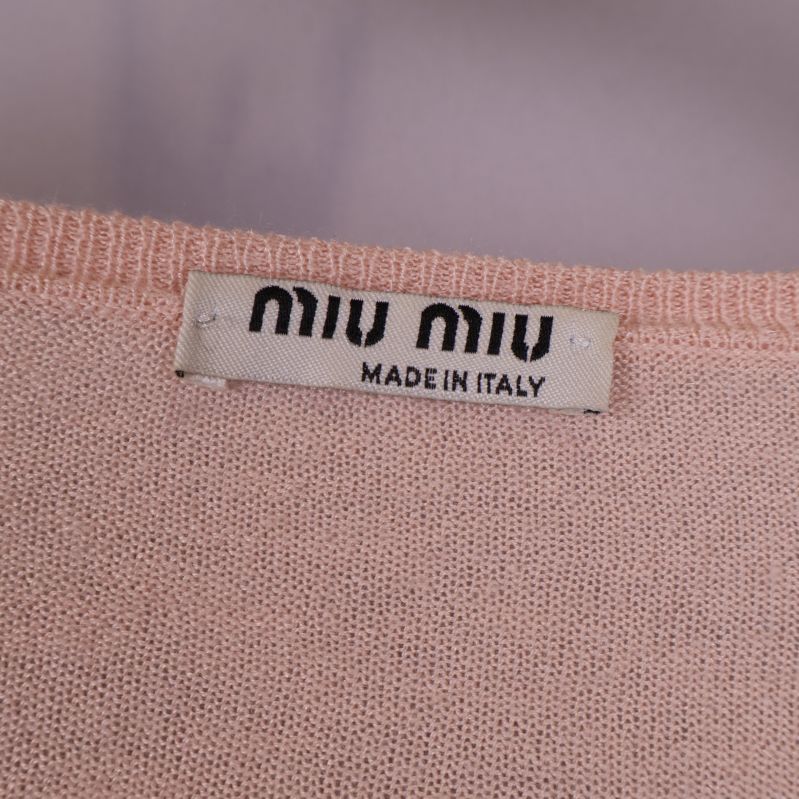 Etikett med Miu Miu-märket