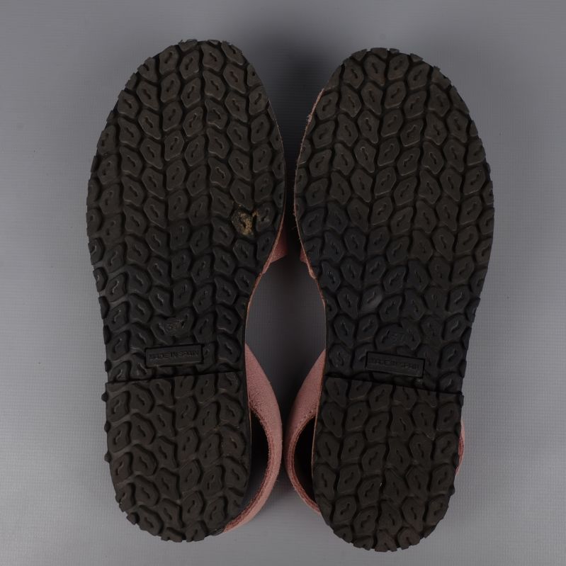 Sole view of sandals showing wear pattern