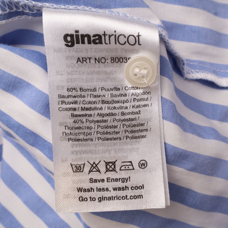 Materialetikett på randig blus