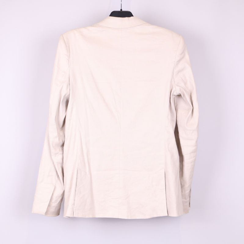 Ljus beige kavaj bakifrån 