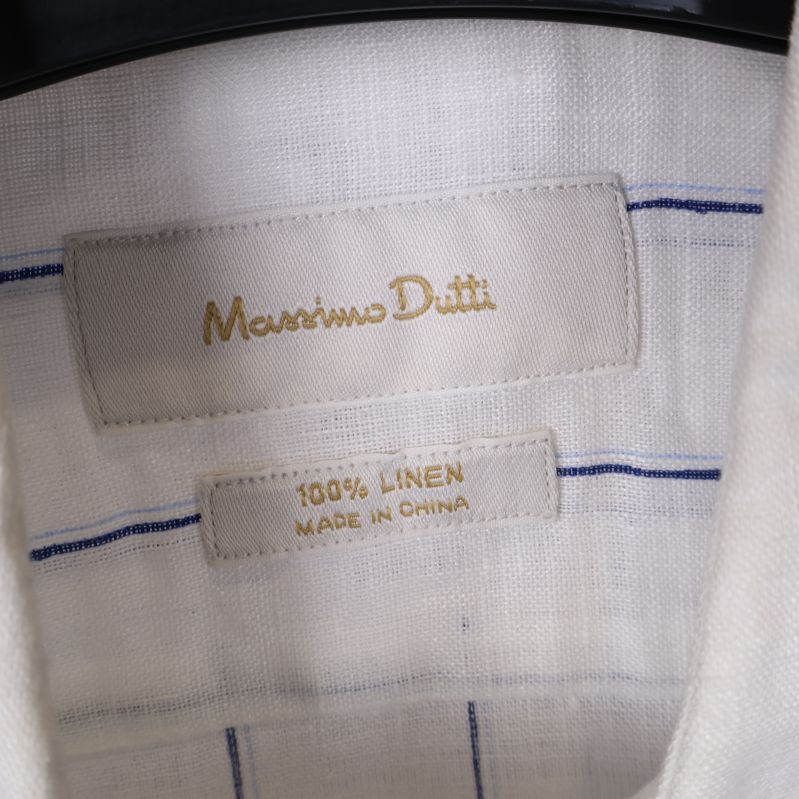 Etikett med Massimo Dutti i guldtext