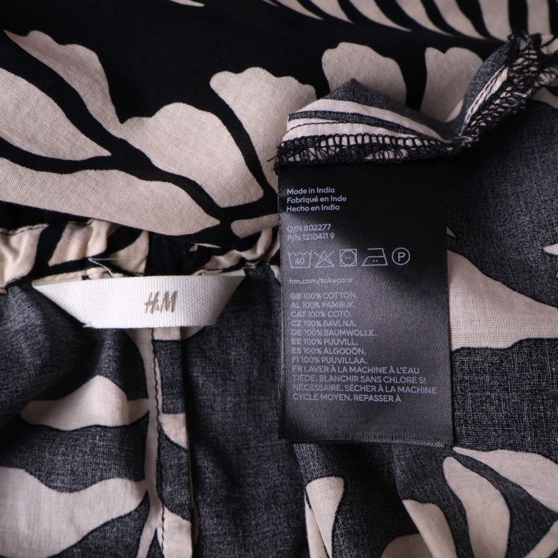 Produktetikett från H&M med material information