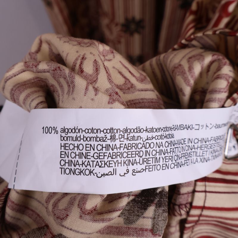 Materiallapp med texten 100% bomull