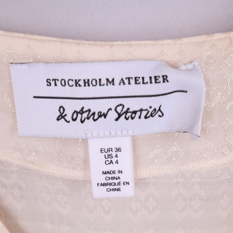 Varumärke & Other Stories etikett