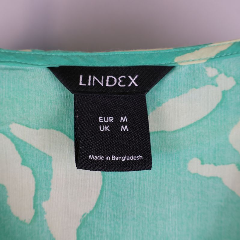 Lindex märkesetikett på blus