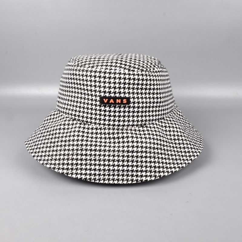 Hundtandsmönstrad bucket hat med logotyp