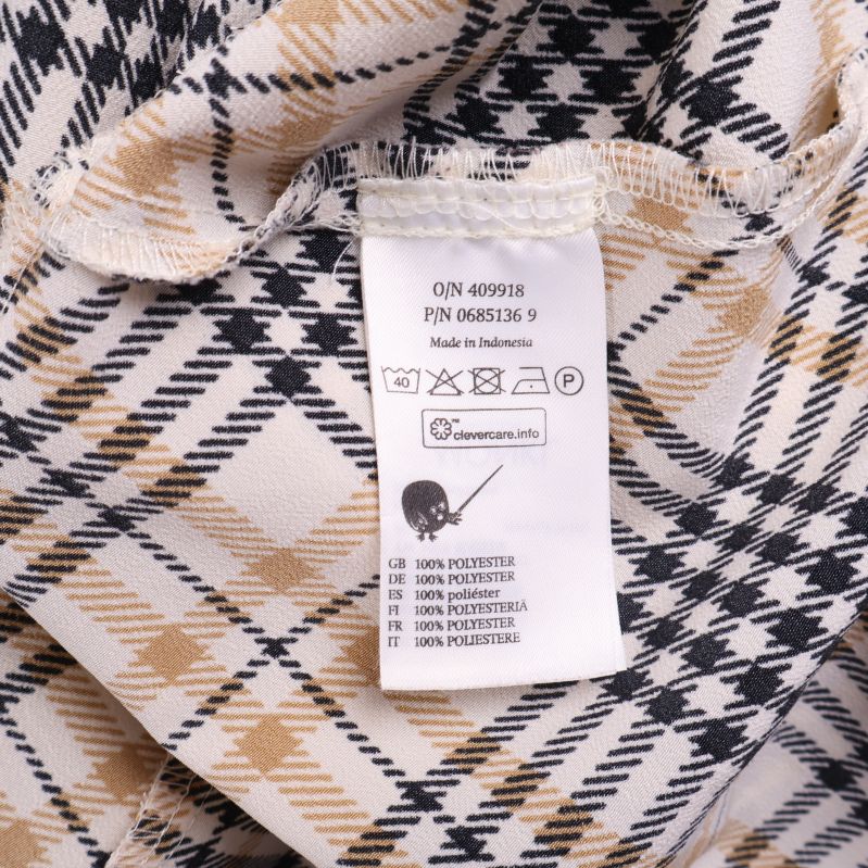 Materialetikett visar polyester material