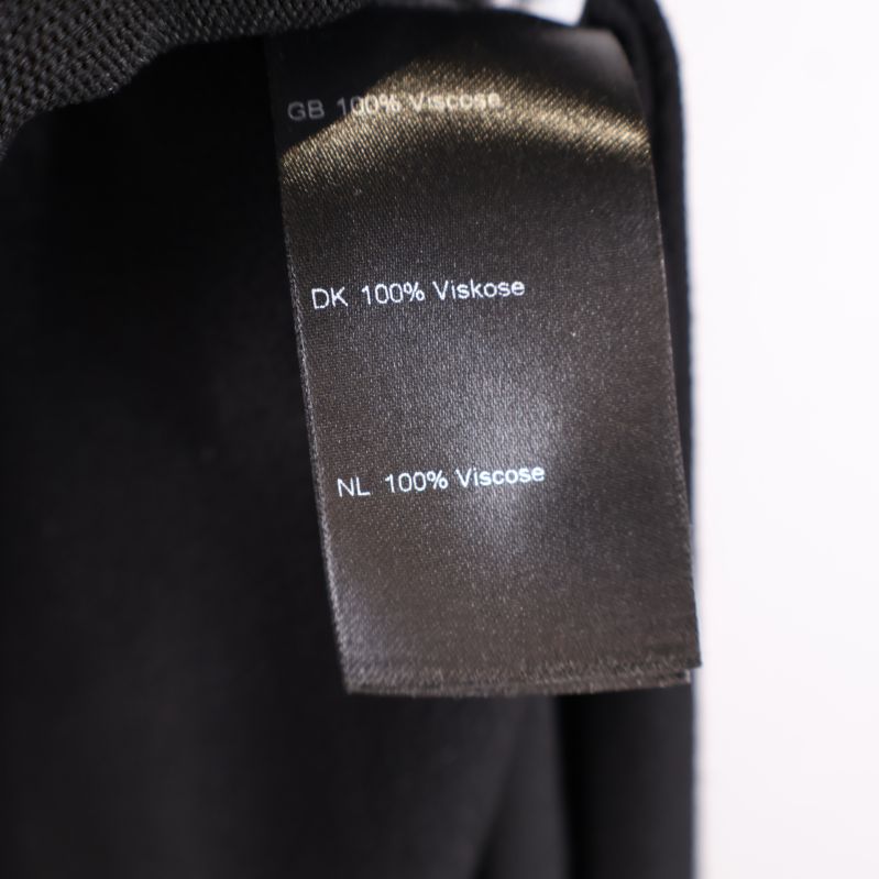 Material etikett visar 100% viskos