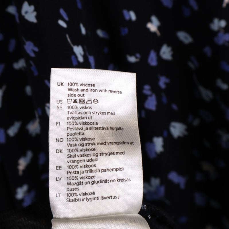 Materialetikett visar 100% viskos