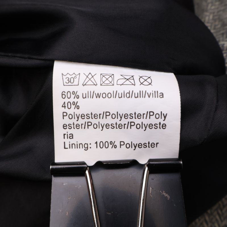 Materialetikett av ull och polyester