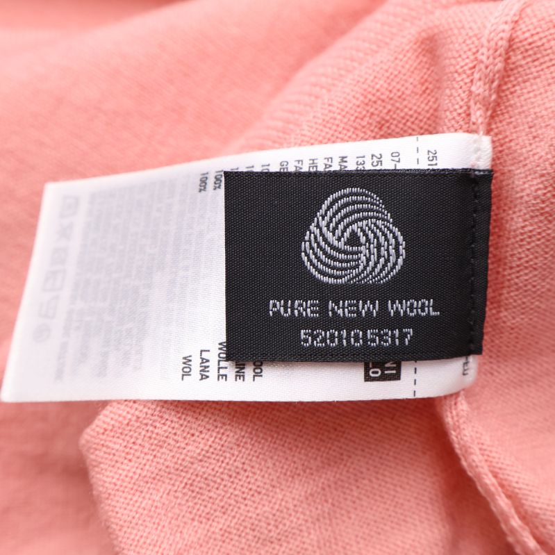 Etikett med text Pure New Wool